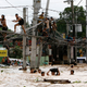 Illustration for article titled Using Power Lines as a Bridge Seems Incredibly Dangerous